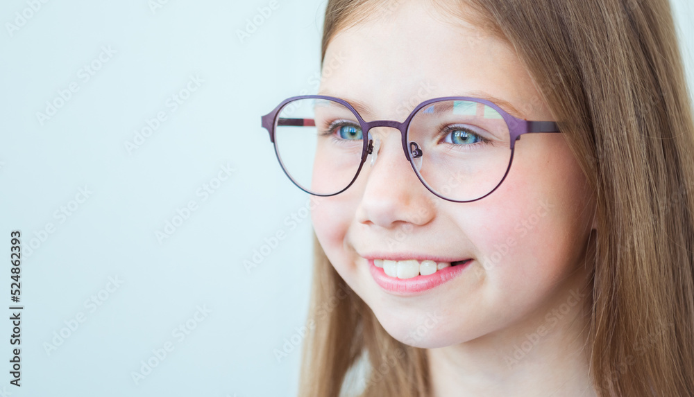 Vision correction for children. Smiling child with stylish eyeglasses on white background Vision correction for children. Smiling child with stylish eyeglasses on white background