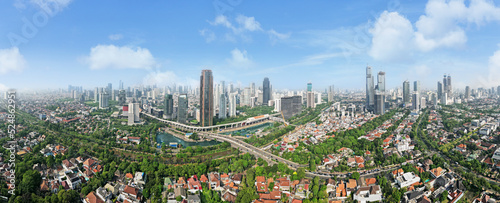 Panorama view of suburban houses with high rises