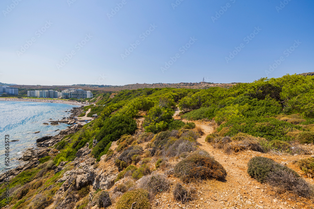 Beautiful view from mountain to coastal rocky line of Mediterranean sea with access to territory of sandy beaches hotels on island of Rhodes. Greece.