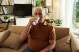 Aged Man Drinking Glass of Water