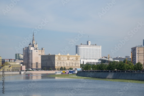 Moscow, Russia - August 12, 2022: Summer view of Krasnopresnenskaya Embankment and the Government House of the Russian Federation   photo