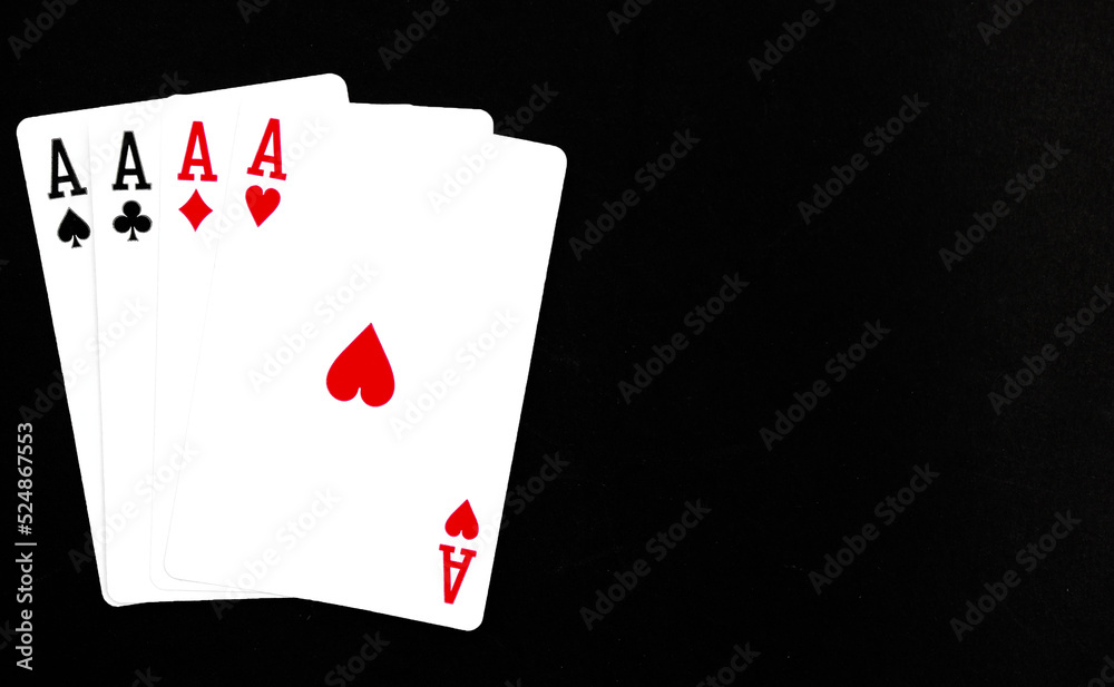 Royal playing cards on a black background.