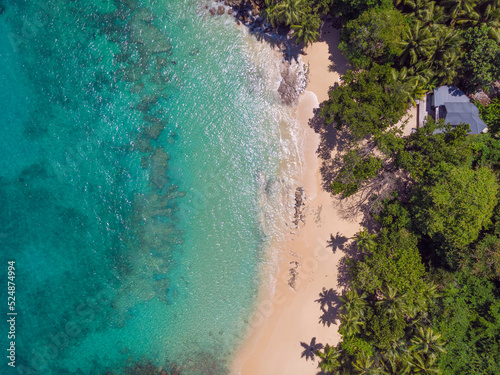 Aerial view from drone of Top Soleil beach at Mahé Island taken in the afternoon light