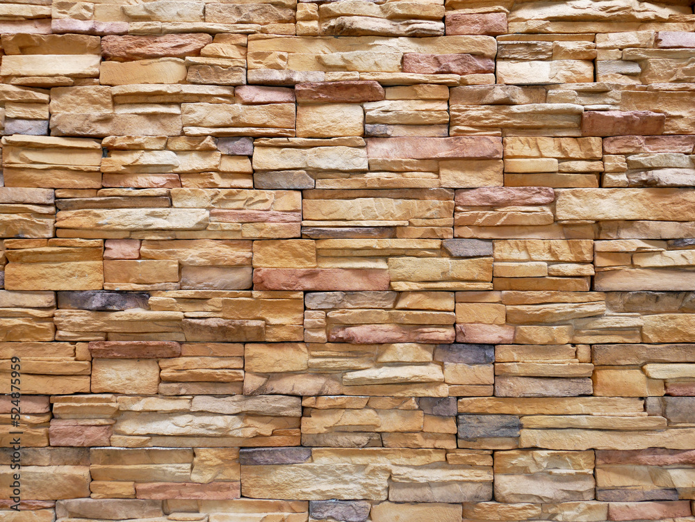 Artificial stone cladding. Designed to resemble real stone. Arranged vertically and attached to the wall with a special adhesive. Used as decoration on the walls of buildings. Artificial stone cladding. Designed to resemble real stone. Arranged vertically and attached to the wall with a special adhesive. Used as decoration on the walls of buildings.