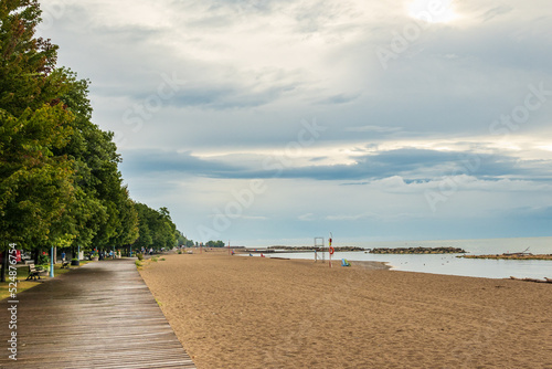 The wooden board walk along Kew and Balmy Beaches in Toronto on an August morning rain.  Room for text.