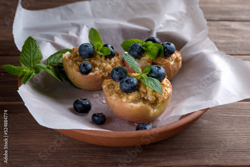 Baked in an apple oven with cottage cheese, cinnamon and mint on parchment paper. Diet food. Autumn dish. Traditions of Ukrainian and German cuisine.