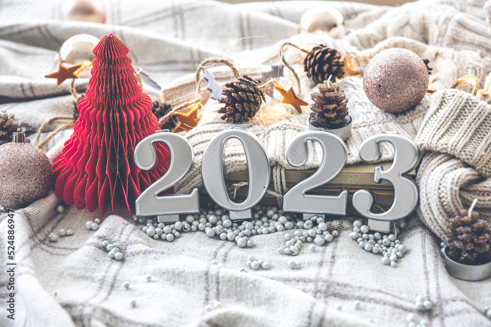 Christmas cozy background with numbers 2023 and decor details.