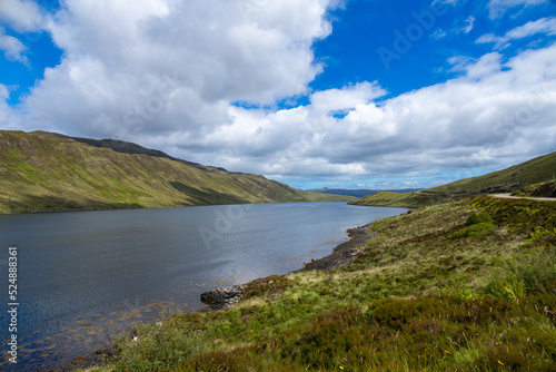 Scottish Highlands typical landscaped and scenery, bright green lawns, roads to nowhere, tranquil lochs. Fairy tale views.