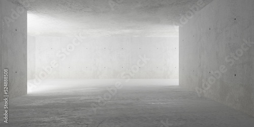 Abstract large, empty, modern concrete room, indirect light from behind wall from the sides and rough floor - industrial interior background template