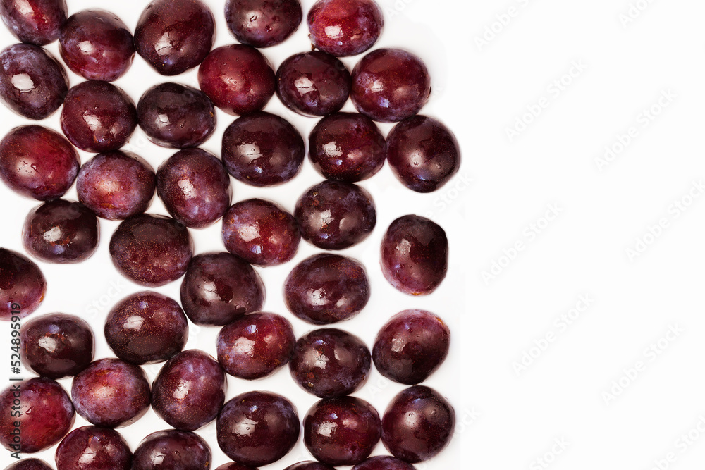 Natural background of many plums on white