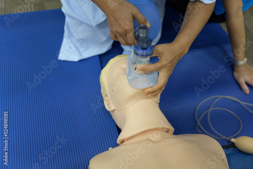 Принти на полотні Demonstrating CPR (Cardiopulmonary resuscitation) training medical procedure on CPR doll in the class