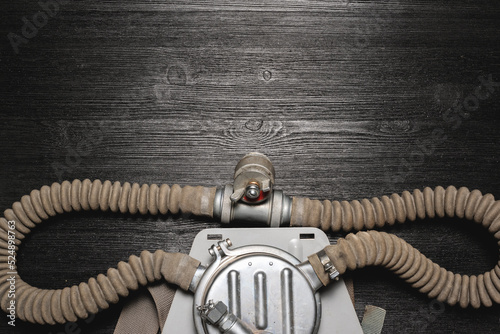 Photography Old vintage scuba aqualung on the black flat lay table background with copy space