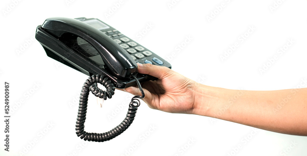 Hand holding office phone in white background. Hand holding office phone in white background.