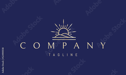 Vector golden logo on which an abstract image of the rising sun against the background of the hills.