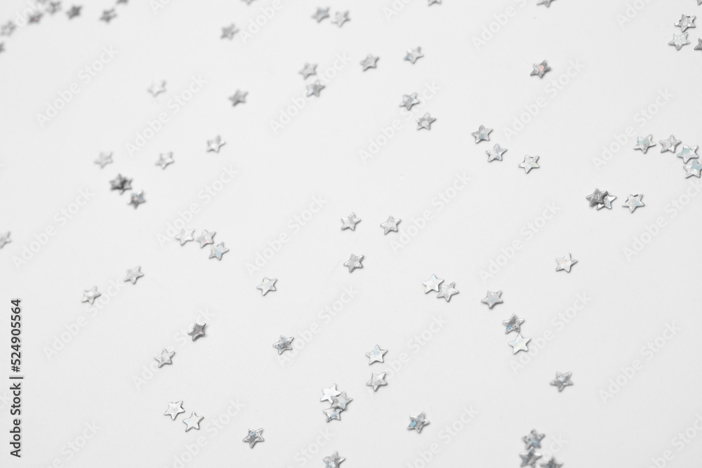 sparkles silver stars on white background with text place- Image