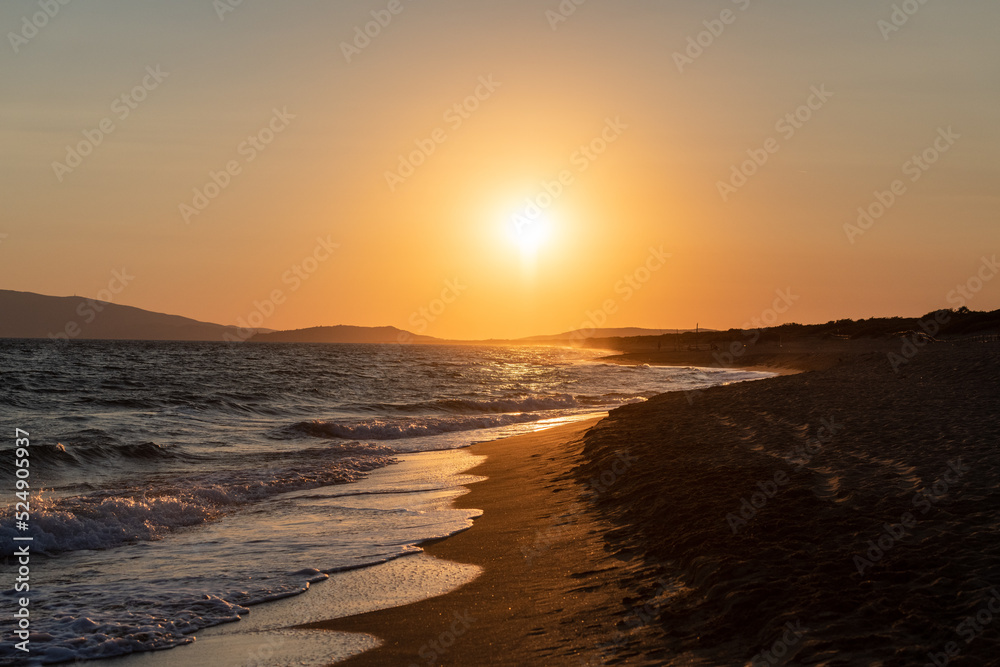 Sunset with sea and sun path over the water and beach Sunset with sea and sun path over the water and beach