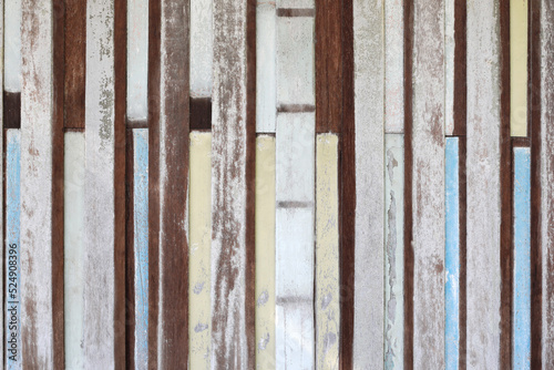 Multicolored grunge wooden wall.