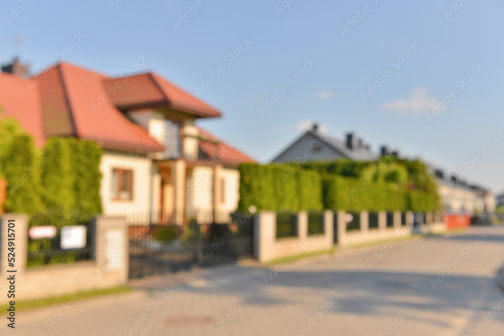 Blurred view of beautiful houses on sunny day
