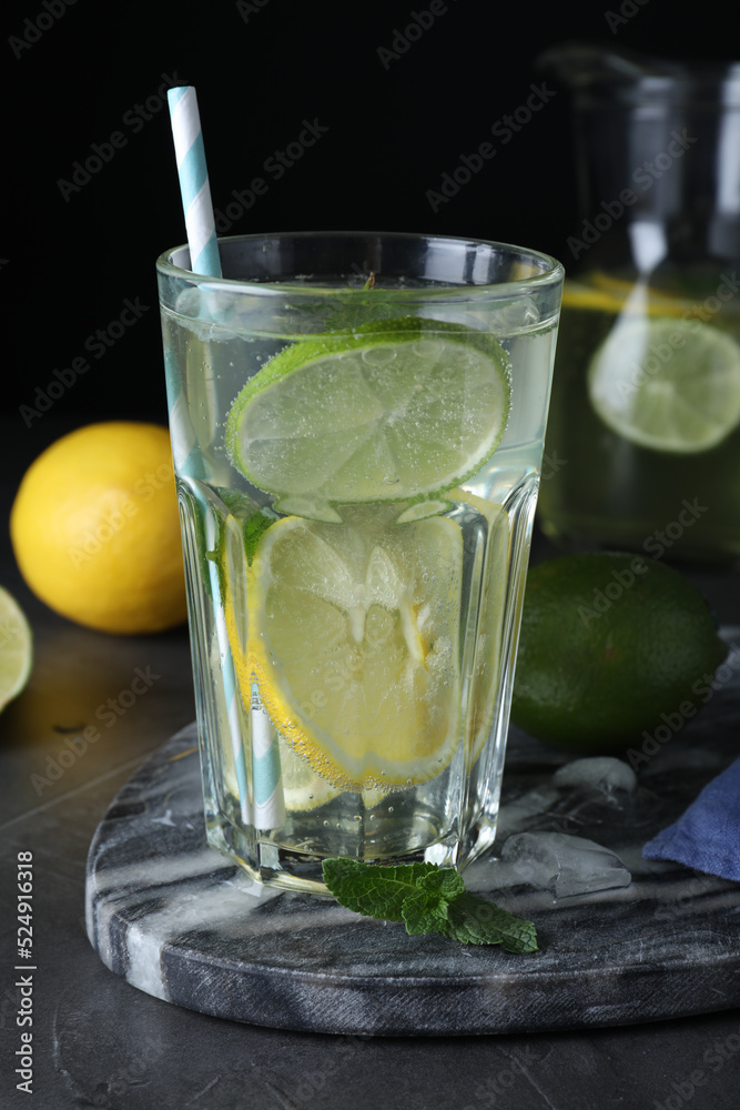 Delicious lemonade made with soda water and fresh ingredients on grey table Delicious lemonade made with soda water and fresh ingredients on grey table