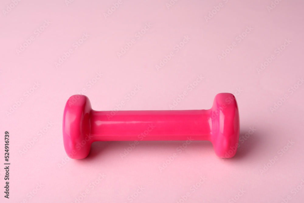 One color dumbbell on light pink background