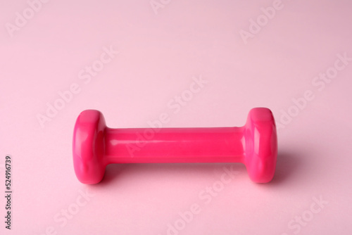 One color dumbbell on light pink background
