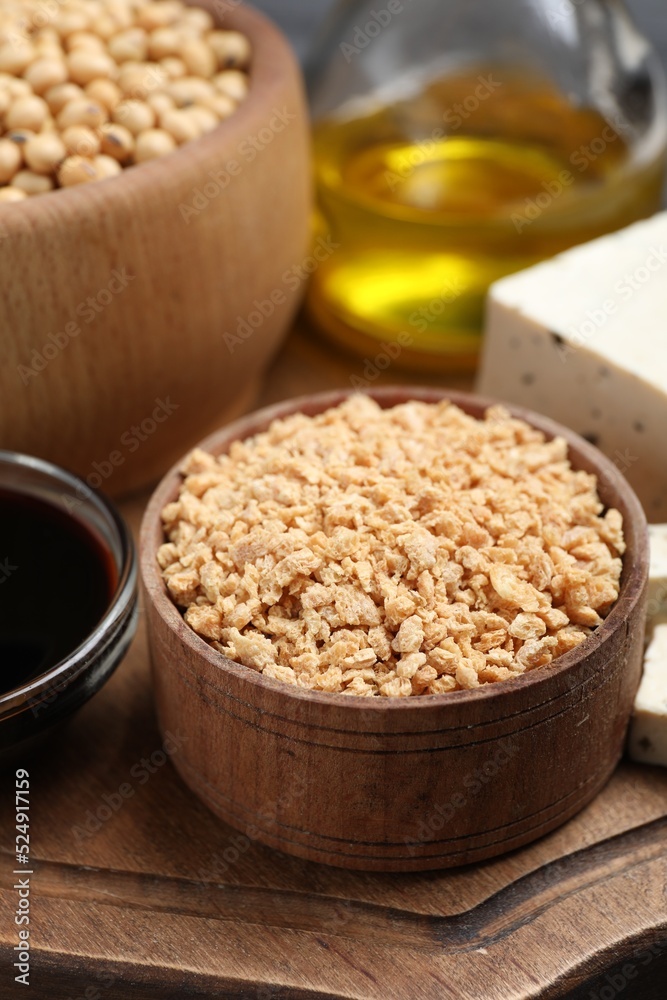 Dehydrated soy meat and other organic products on wooden board, closeup Dehydrated soy meat and other organic products on wooden board, closeup