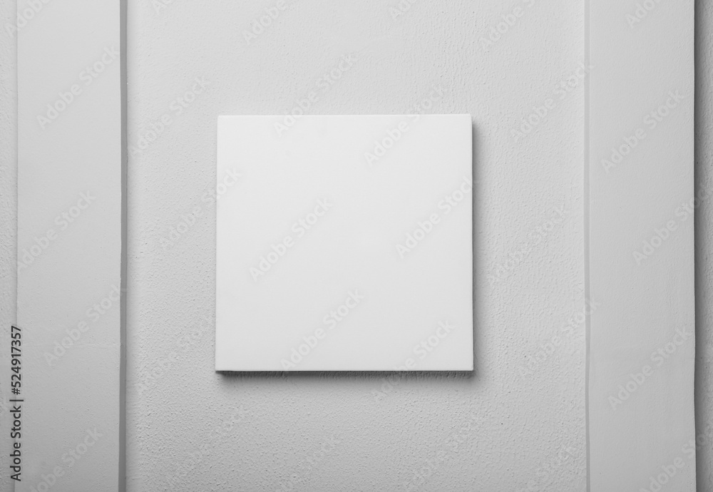 Blank canvas on white wall. Space for design Blank canvas on white wall. Space for design