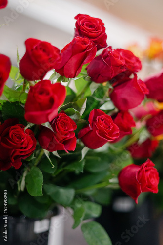 Red roses in a flower shop.Flowers in a flower shop. Concept flower store and delivery.