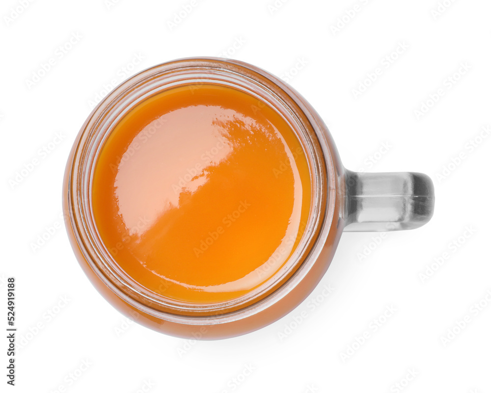 Fresh carrot juice in mason jar on white background, top view Fresh carrot juice in mason jar on white background, top view