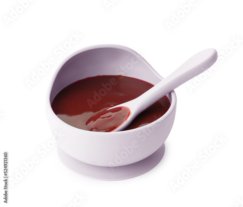 Bowl and spoon with tasty pureed baby food isolated on white