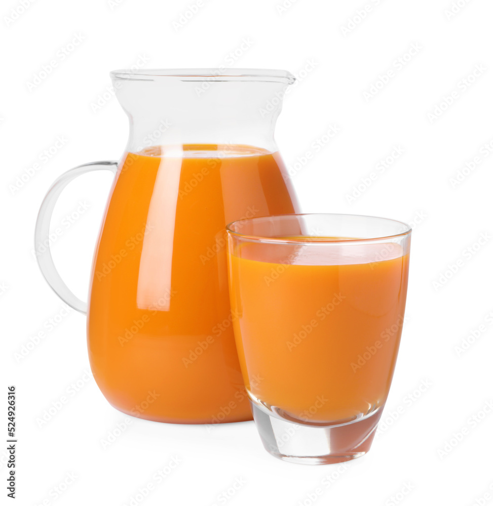 Glass and pitcher of carrot juice on white background Glass and pitcher of carrot juice on white background