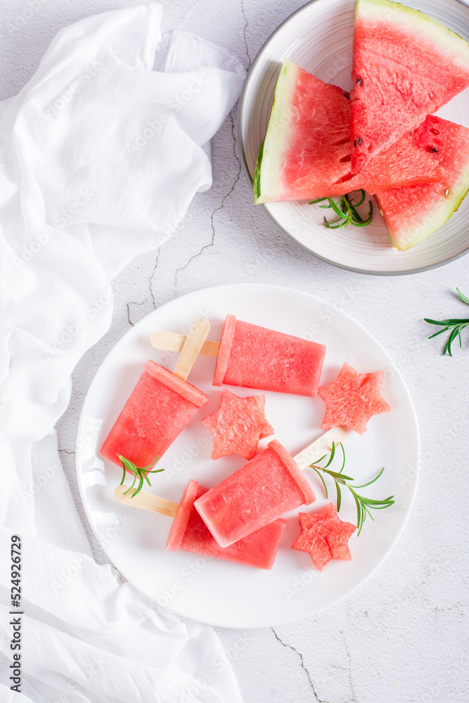 Watermelon ice cream and pieces of watermelon on a plate. Homemade dessert. Top and vertical view Watermelon ice cream and pieces of watermelon on a plate. Homemade dessert. Top and vertical view
