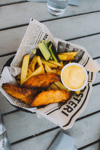 chichken and chips on a plate photo