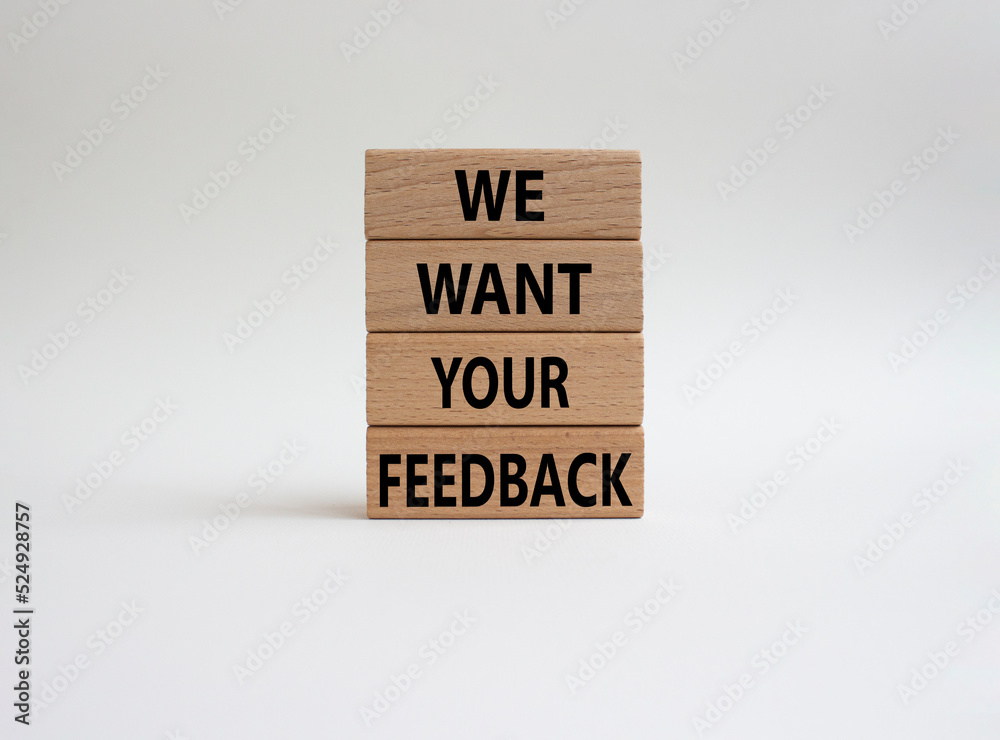 We want your feedback symbol. Wooden blocks with words We want your feedback. Beautiful white background. We want your feedback concept. Copy space.
