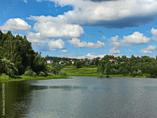 Summer clouds over a pond near Moscow