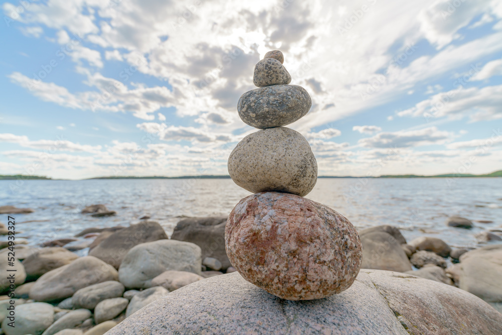 Pyramid of stones. Unstable balance of stone objects. Idyllic state of nature. Pyramid of stones. Unstable balance of stone objects. Idyllic state of nature.