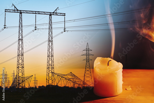 Extinguished candle and power lines on background. Energy outage and blackout. Energy crisis. Price increase of electricity for home and industry. photo