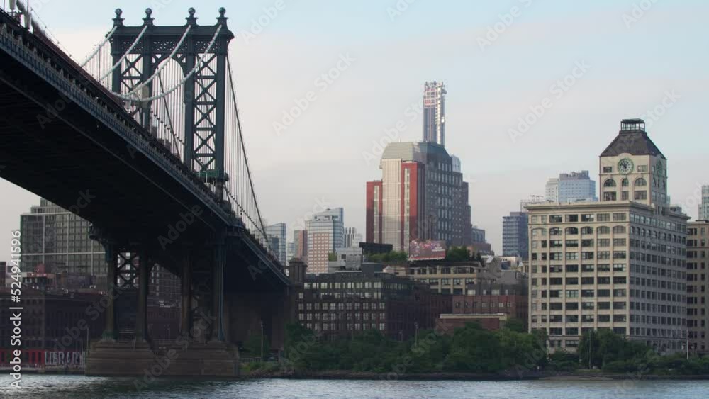 Manhattan bridge a suspension bridge that crosses the East River in New York City, connecting Lower Manhattan at Canal Street with Downtown Brooklyn. Exterior of skyscrapers. NYC, USA Manhattan bridge a suspension bridge that crosses the East River in New York City, connecting Lower Manhattan at Canal Street with Downtown Brooklyn. Exterior of skyscrapers. NYC, USA