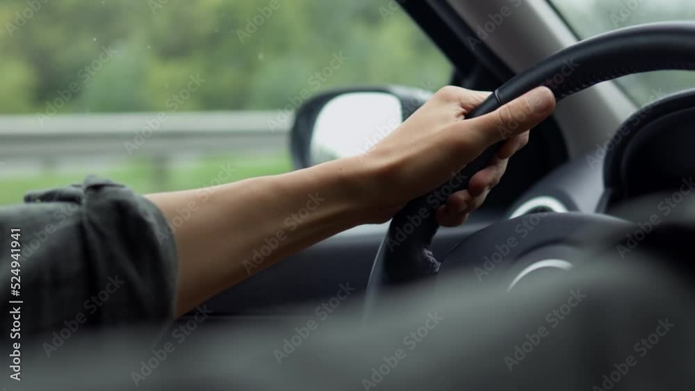 Anger aggression driver hand knocking on the steering wheel of the car, the driver is angry at