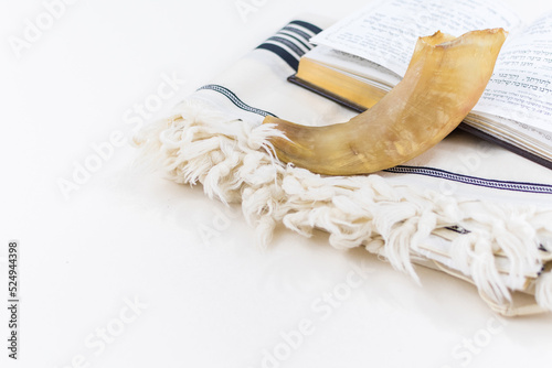 Prayer Shawl - Tallit, Prayer book and Shofar (horn) jewish religious symbols. Rosh hashanah (jewish New Year holiday), Shabbat and Yom kippur concept