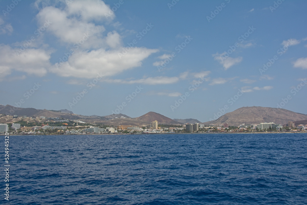 Coast of Tenerife from the sea with blue sky