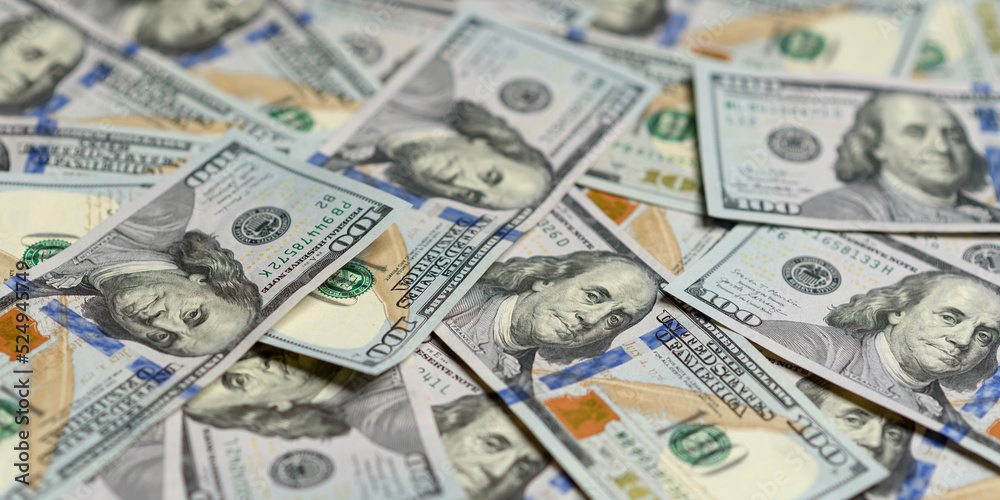 Money background. Texture of US dollars. Hundred dollar bills on the table close-up. Lots of American banknotes in cash. Profit, savings. Stack of dollars. Success, motivation, financial flows, wealth Money background. Texture of US dollars. Hundred dollar bills on the table close-up. Lots of American banknotes in cash. Profit, savings. Stack of dollars. Success, motivation, financial flows, wealth