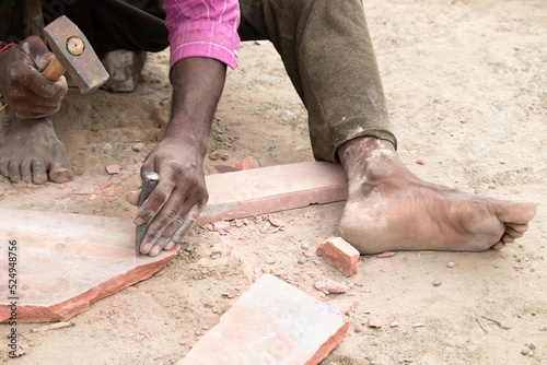 Indian Skilled Labour Making Traditional Pucker Also Known As Silwat Silvat Ammi Kalla or Silbatta Made Of Stone To Grind, Crush Or Smoothen Spices Paste For Curries Manually With Hand photo