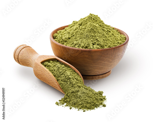 Wooden scoop and bowl full of matcha powder isolated on white