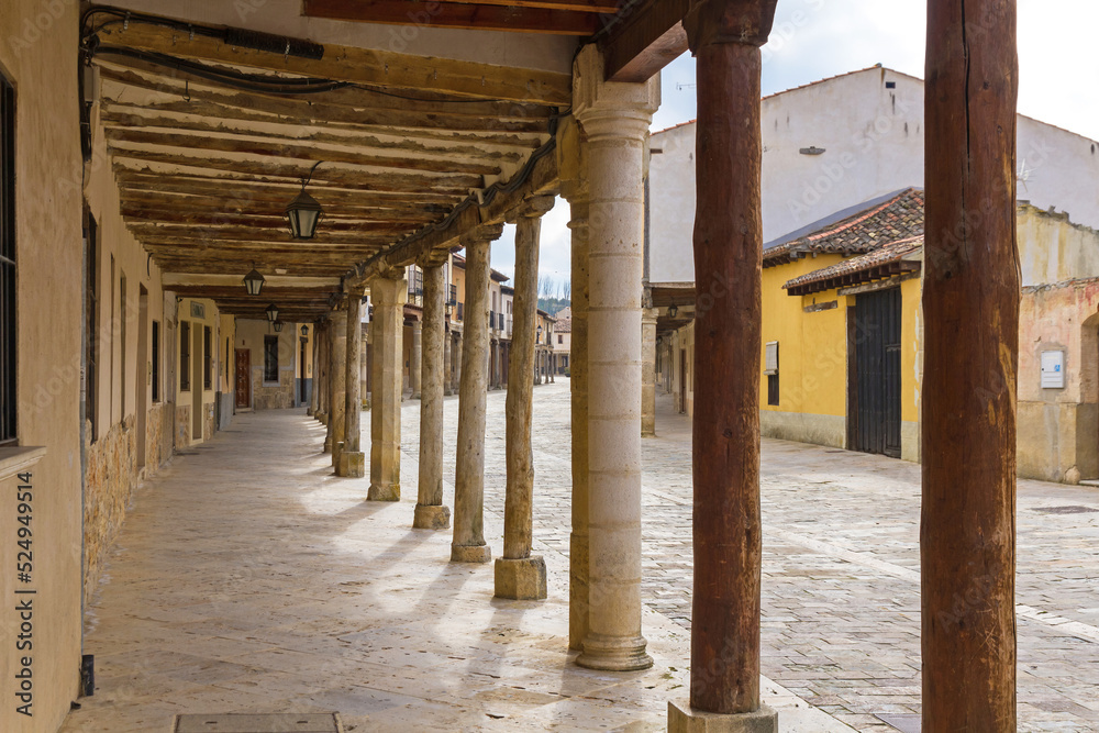 Arcades of the main street of Ampudia in Palencia. Spain