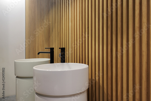 Modern white bathroom sink with faucet