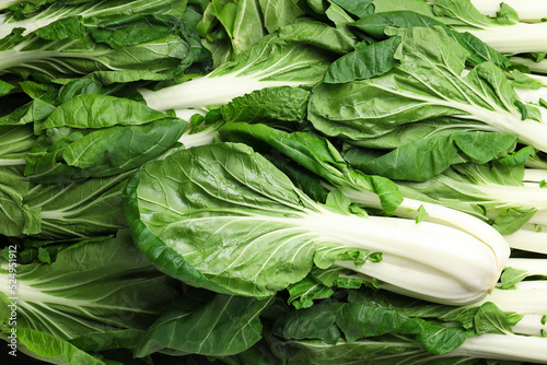 Fresh green pak choy cabbages as background, top view photo