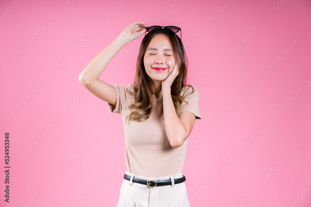 Excited success achievement and glad celebrating of Happy asian young woman confident smiling on the pink background