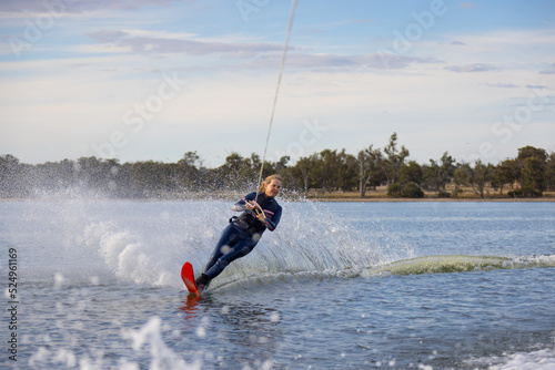 mature woman waterskiing on an inland lake