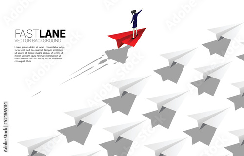 businesswoman standing on red origami paper airplane is move faster than group of white. Business Concept of fast lane for moving and marketing